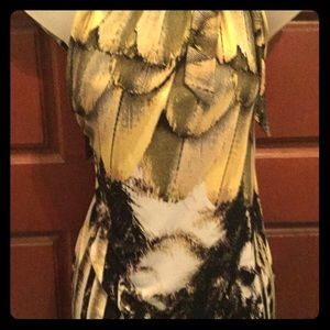 Lovely, flirty and fun sleeveless dressy top.